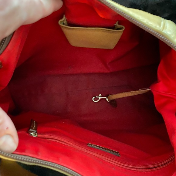 Dooney and Bourke bag. Soft tan/golden color with red interior - Picture 9 of 10
